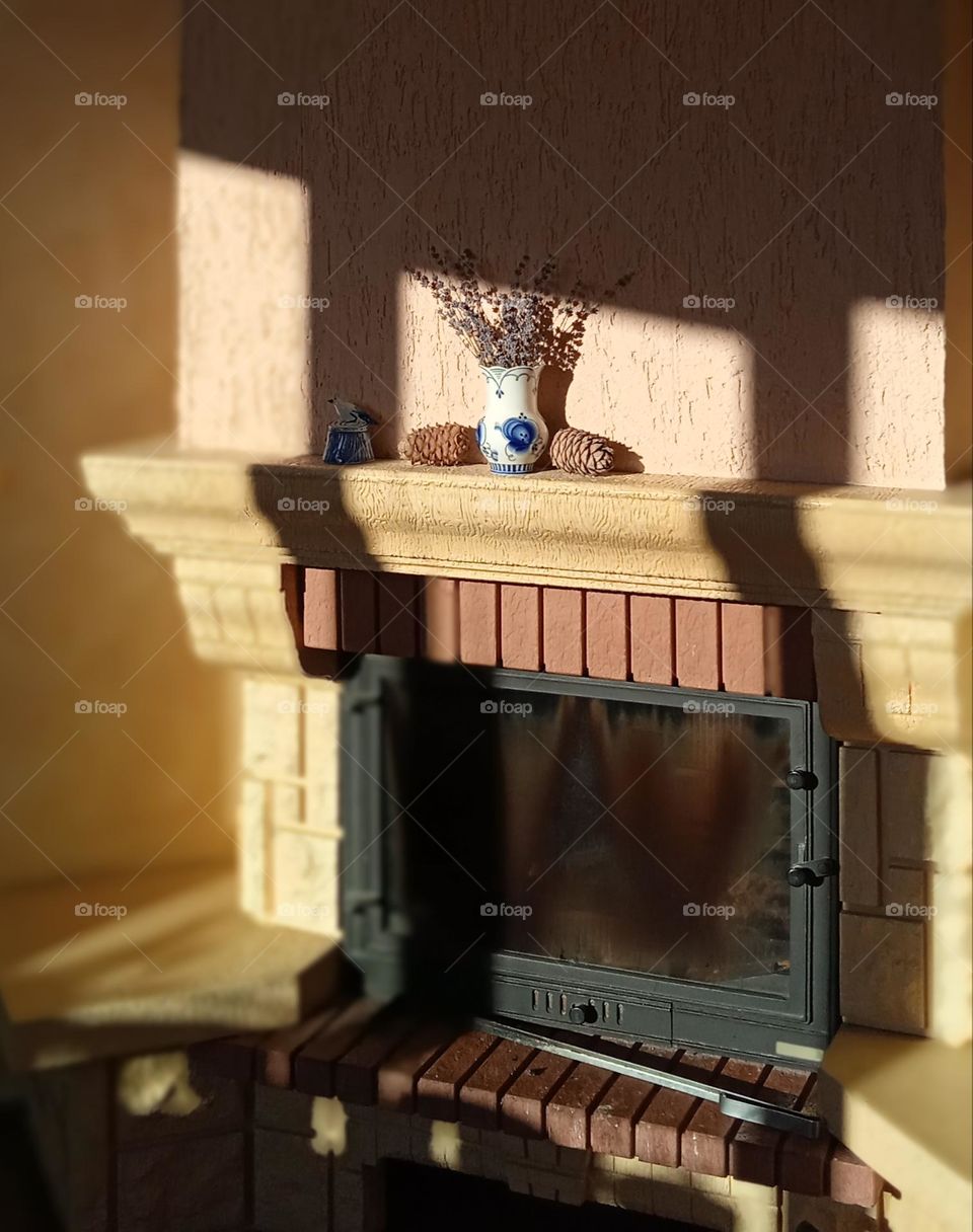 a mantelpiece illuminated by the sun