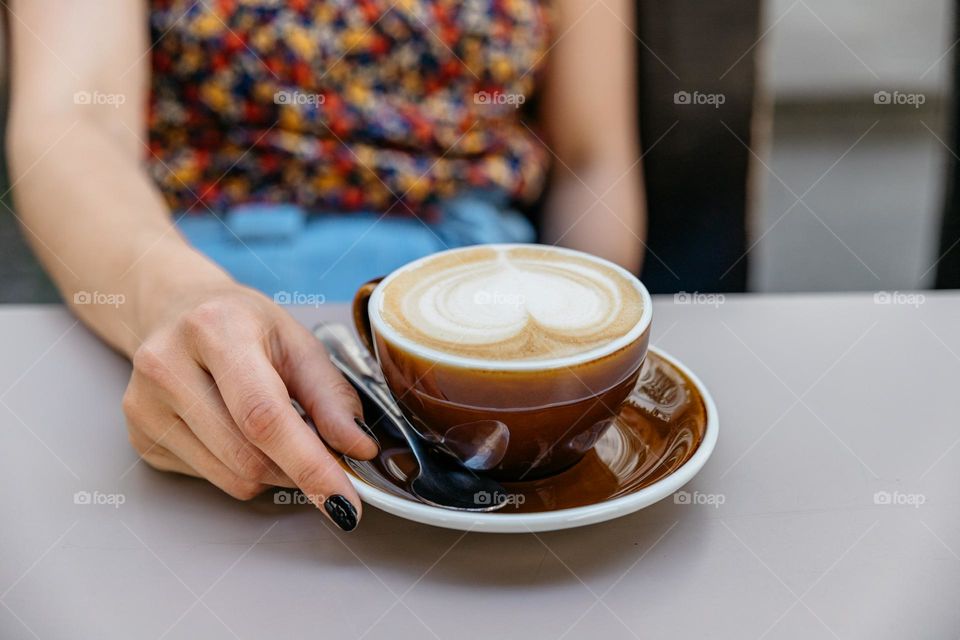 Woman drinking coffee.