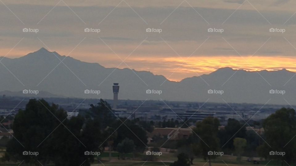 Sunset behind South Mountains, Phoenix Sky Harbor Airport in foreground