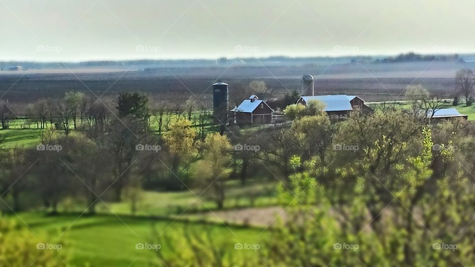 The farm. quaint farm seen high up on a hill