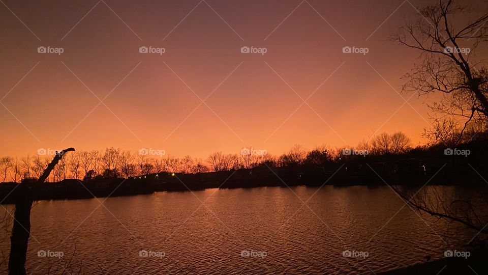 Twilight and Sunbeams-Rays. Awesome Colors during Evening. Reflections of colors on Lake Waters. Darker Colors of Twilight keeps reflections down on Lake.