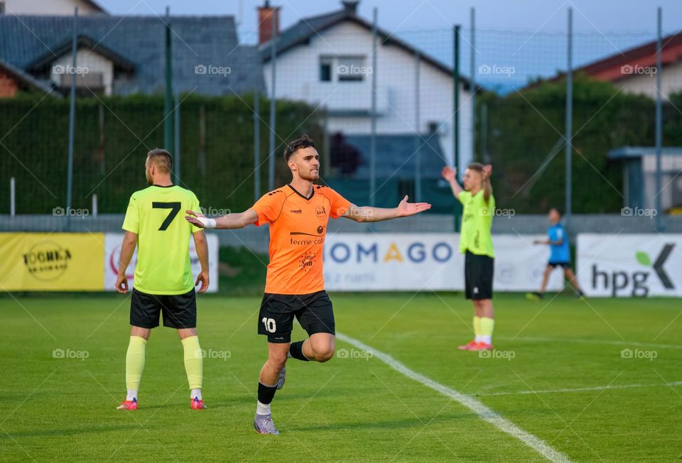 Young football player celebrating a scored goal