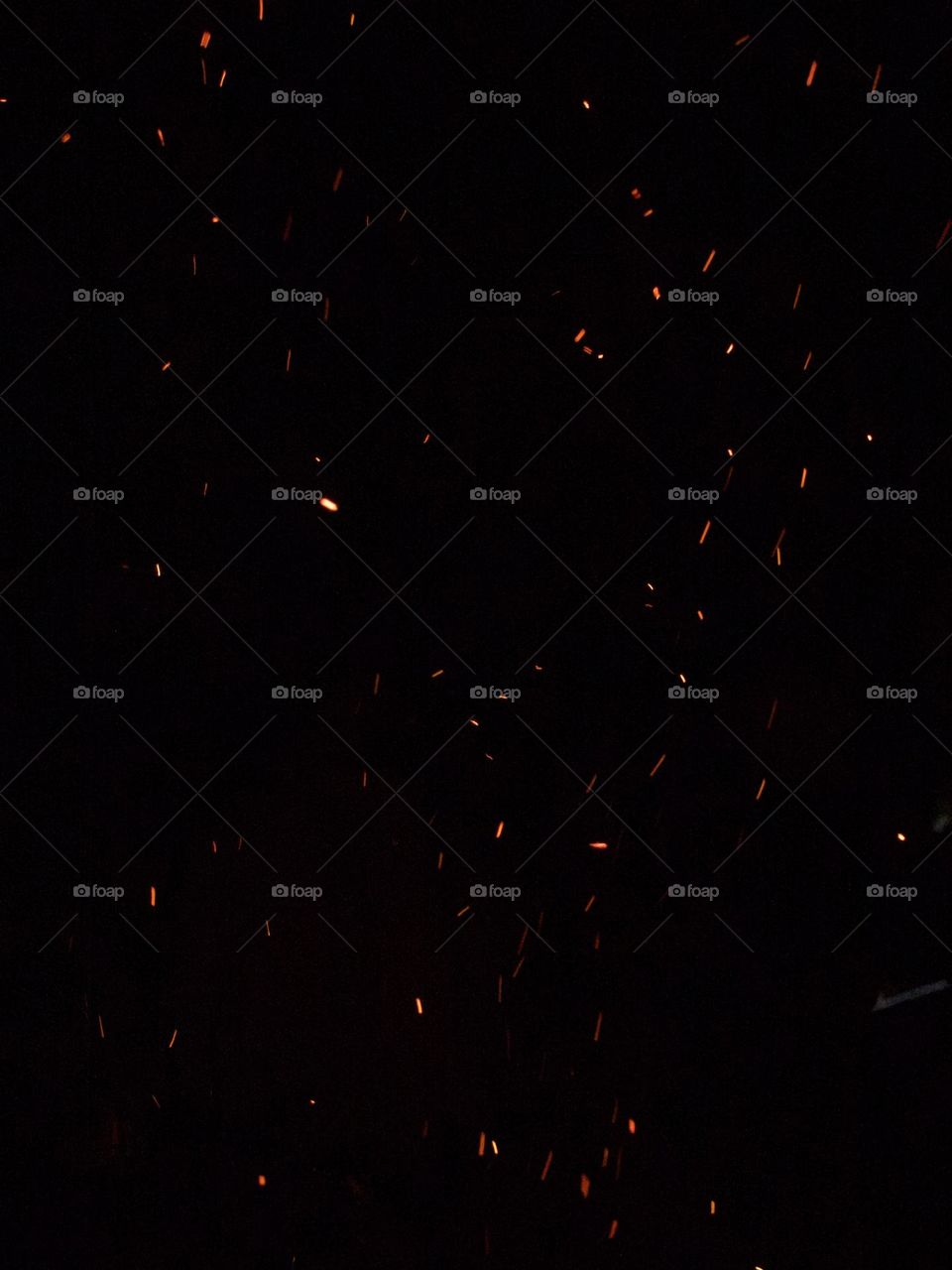 Fire sparks in the night sky 