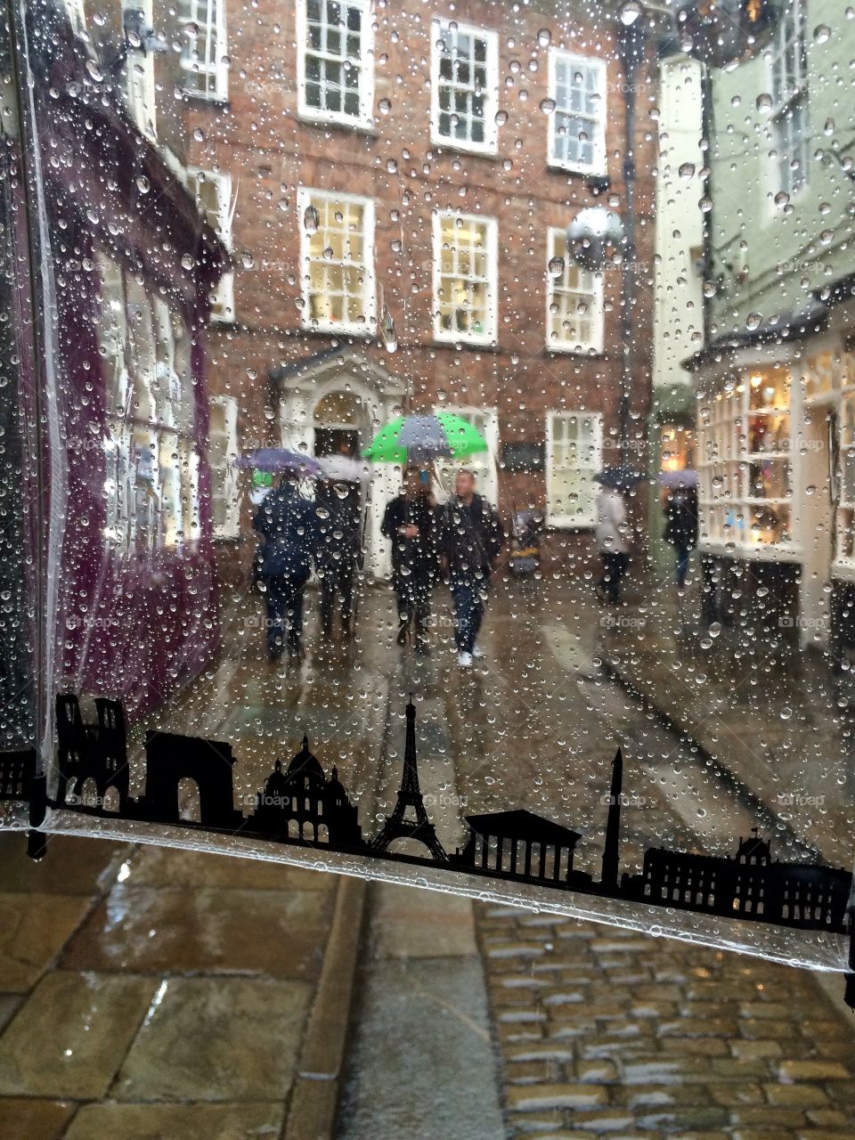Umbrella View . Looking for a pub round the corner  to shelter from the rain ....
