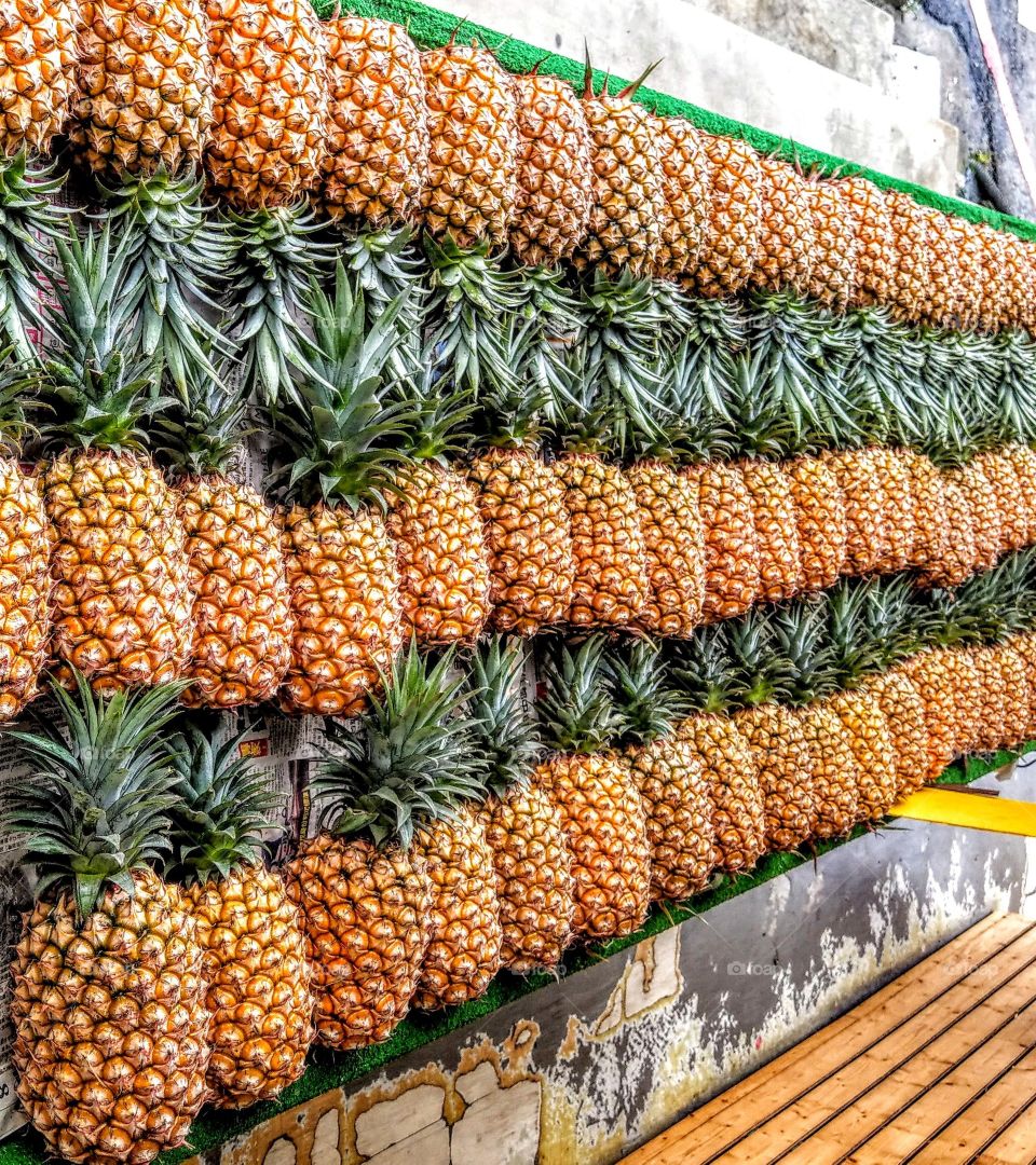 the pineapples in fruit store, looked delicious and beautiful.