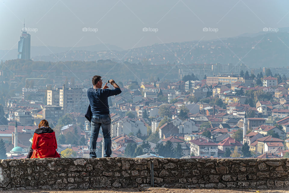 Man shooting polluted city