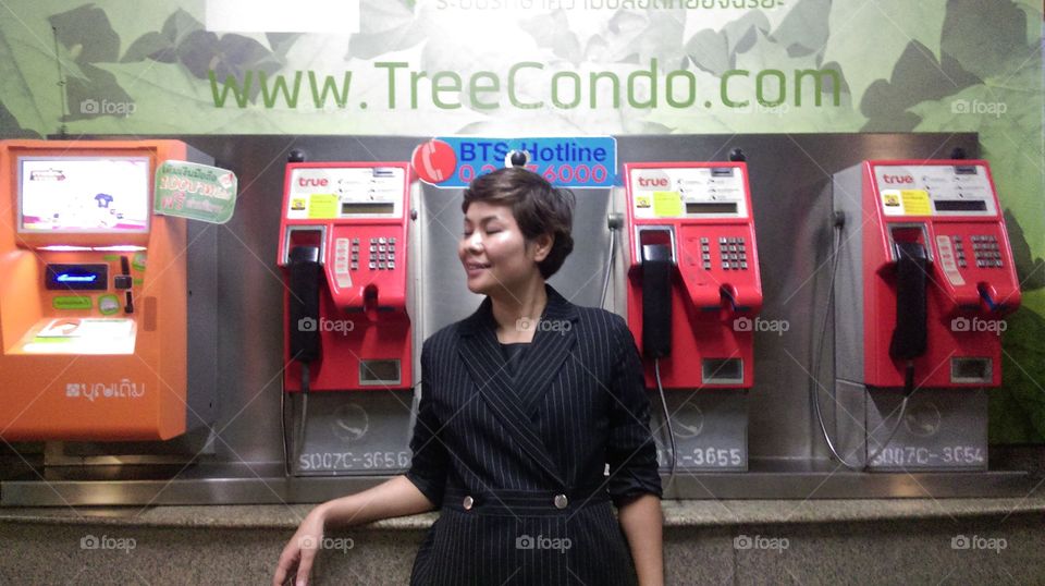 Woman and public phone 