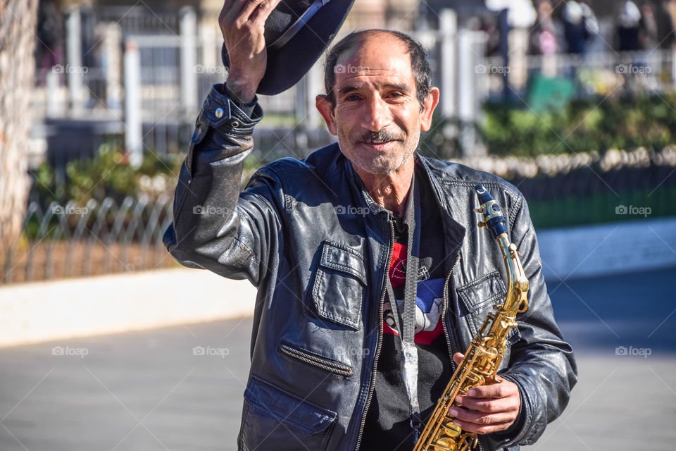 Street Musician With A Saxophone
