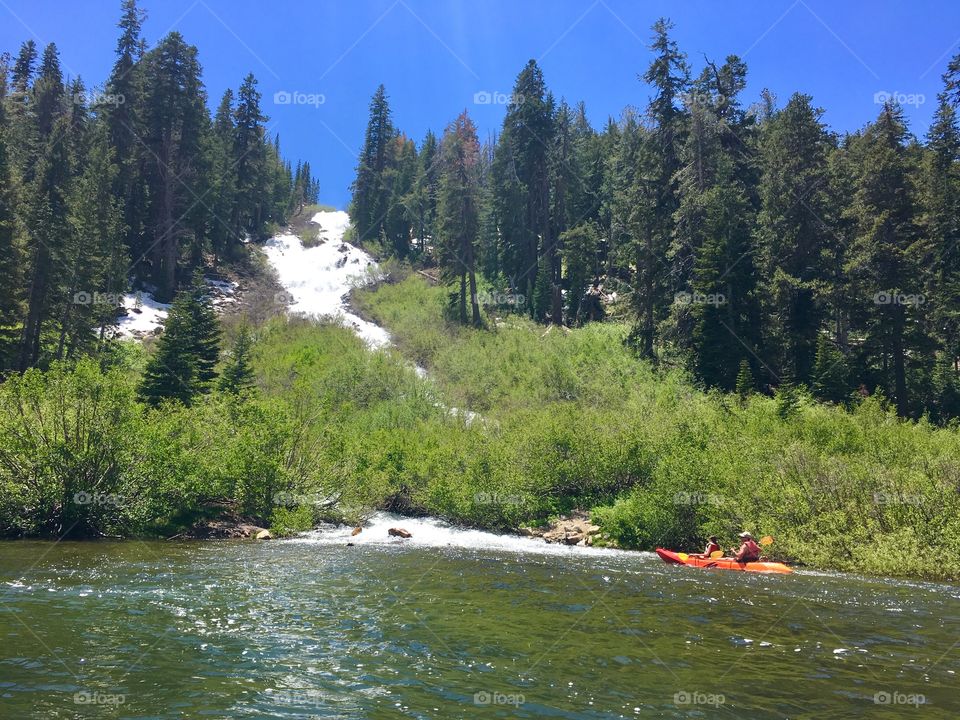 Kayaking to waterfall in July