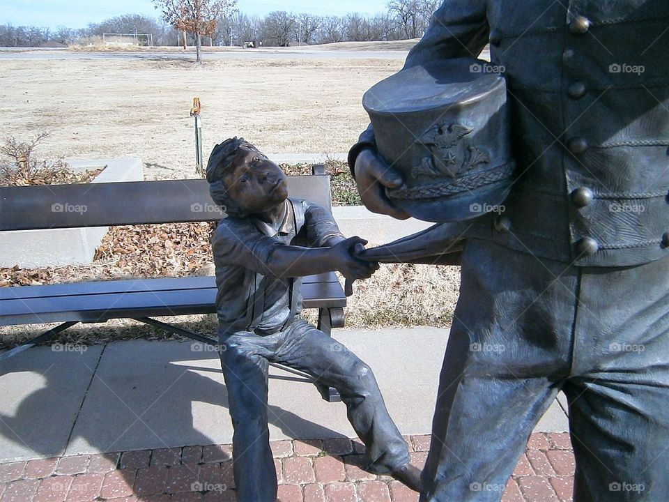 statue little boy saying don't go