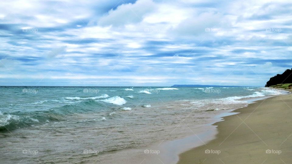 Turbulent Waters against soft sky