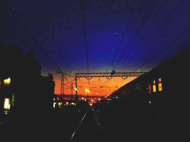 Evening Station . Station during sunset and bright windows of the train