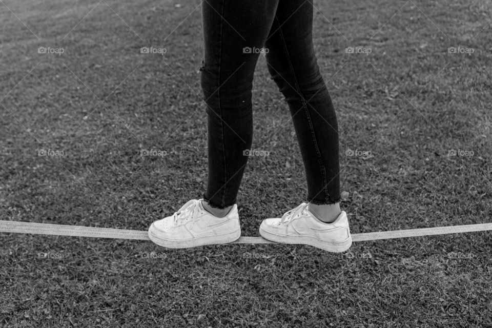 shoes and a slackline black and white