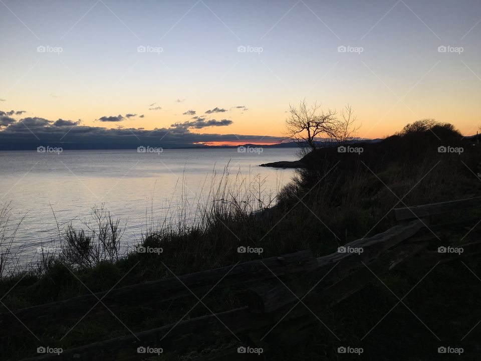 Silhouette land by the beach