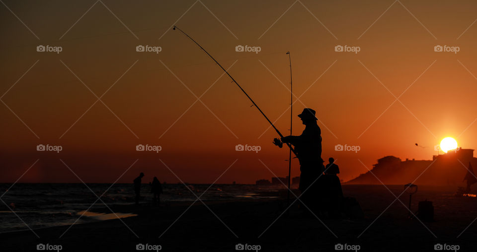 Fishing at sunset in Florida on a hot summer evening