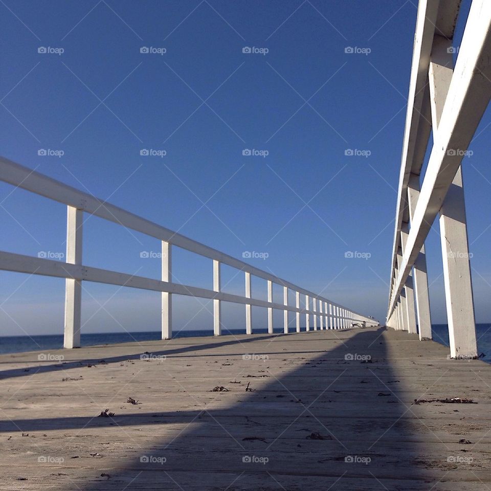 View of empty wooden bridge