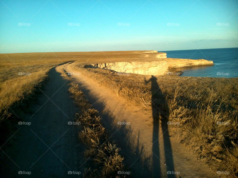 shadows person in the steeple and sea shore sunny day, summer vacation