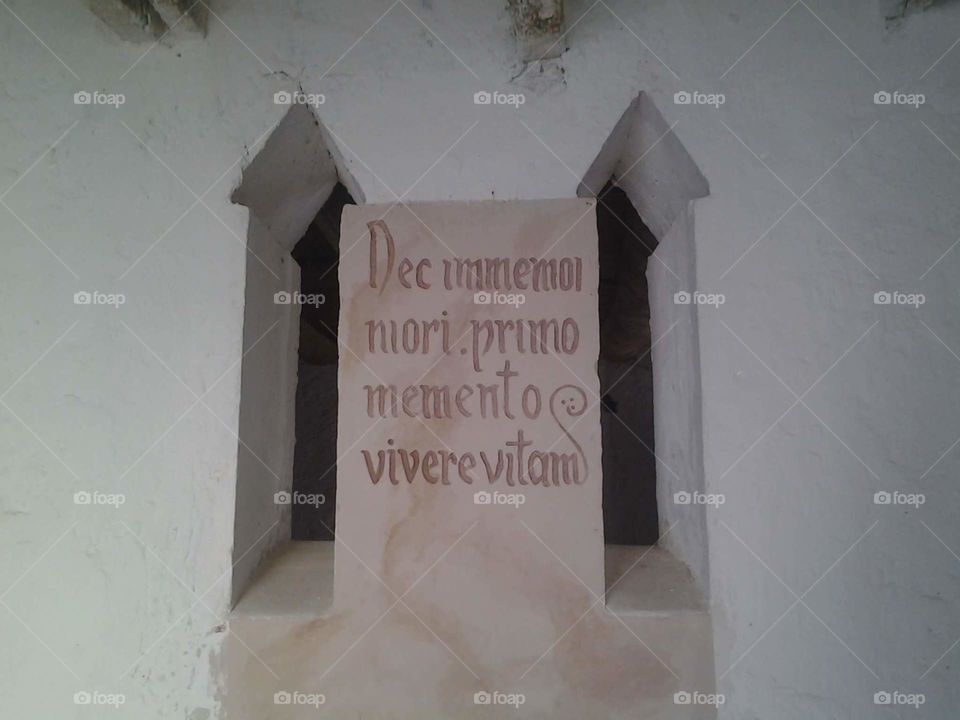 Latin manuscript on wall - Historical building in Ouled Djellal