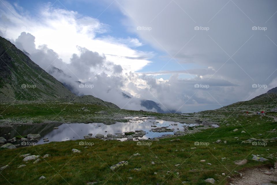 View of clouds over green mountain, Slovakia