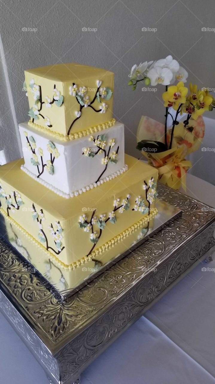 Yellow orchids and cake