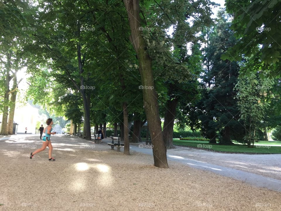 Female runner in Luxembourg garden park in Paris France 