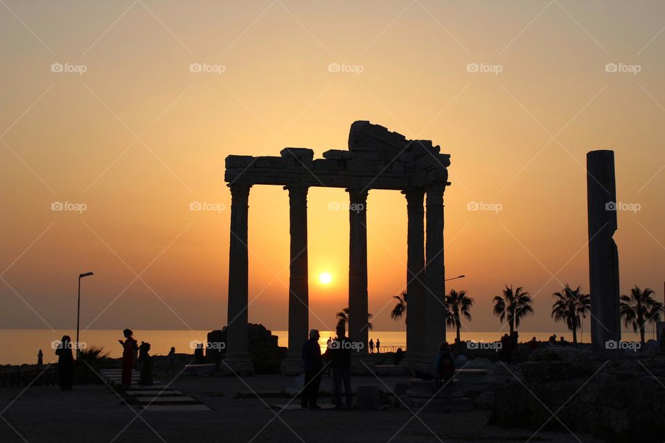 Magical panoramic sunset views among the ancient ruins of Side archaeological site in Turkey. 