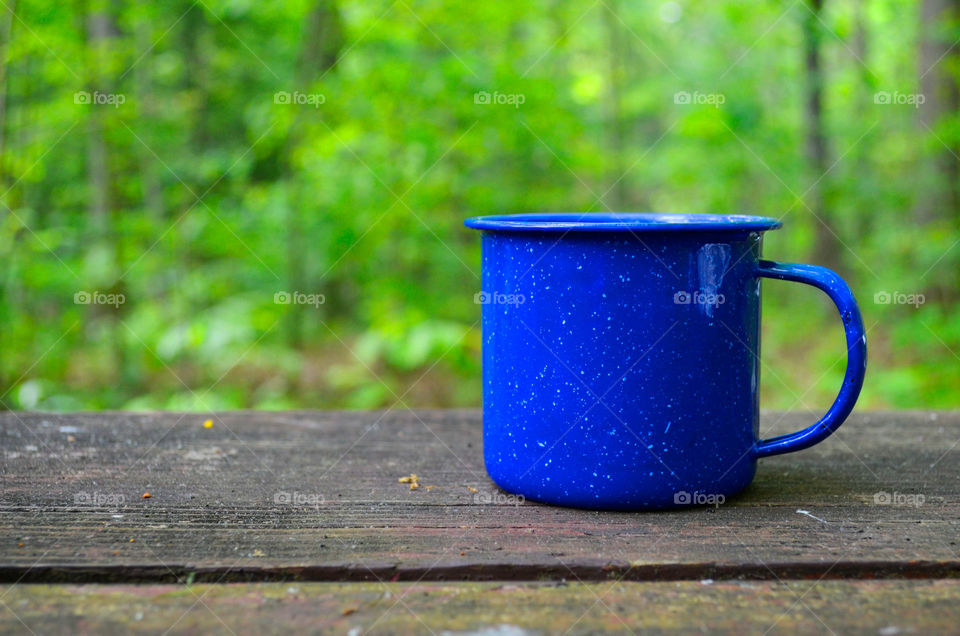 Close-up of blue coffee cup