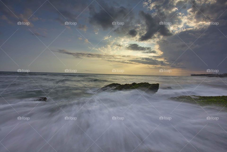 cloudy sunset and wave motion