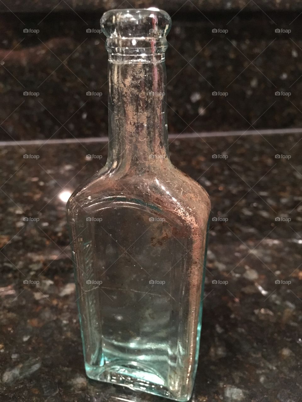My husband was digging in the yard and found this old bottle.