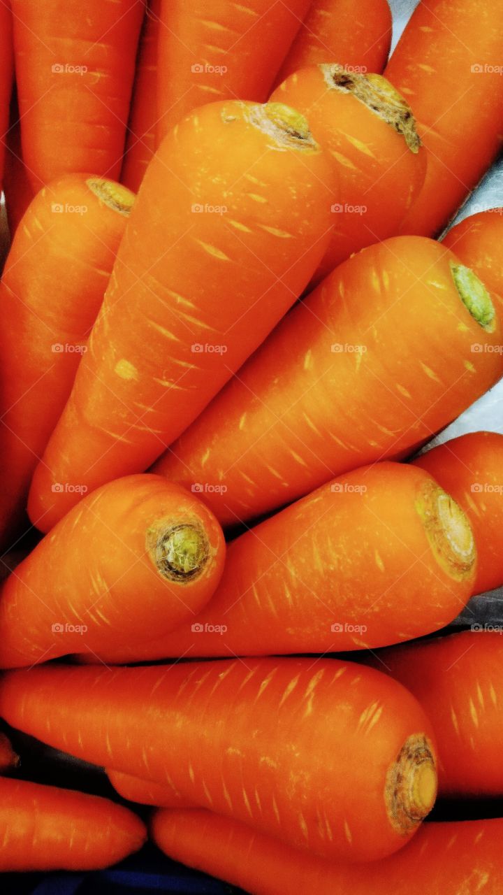 Fresh carrots are sold in the market