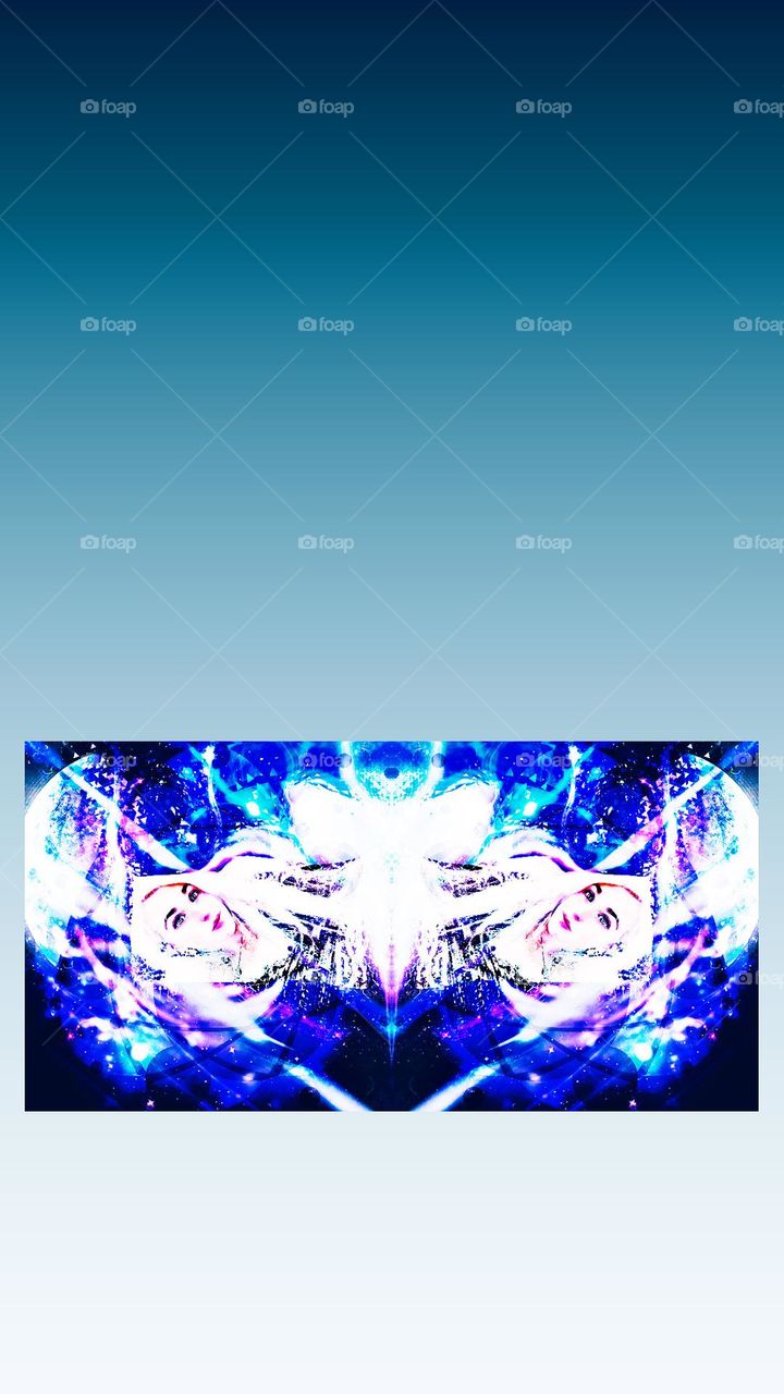 A photo editing picture, looks like a butterfly when mirrored brilliant color and universe in background