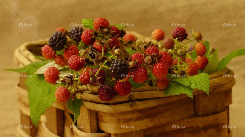 Fresh blackberries in straw woven basket