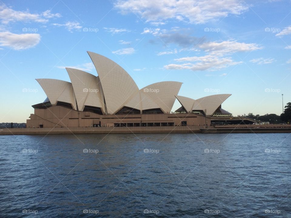 Sydney Opera House. Riding the ferry home after a day in the office, the beautiful Opera House with the sun on it and blue skies overhead. 