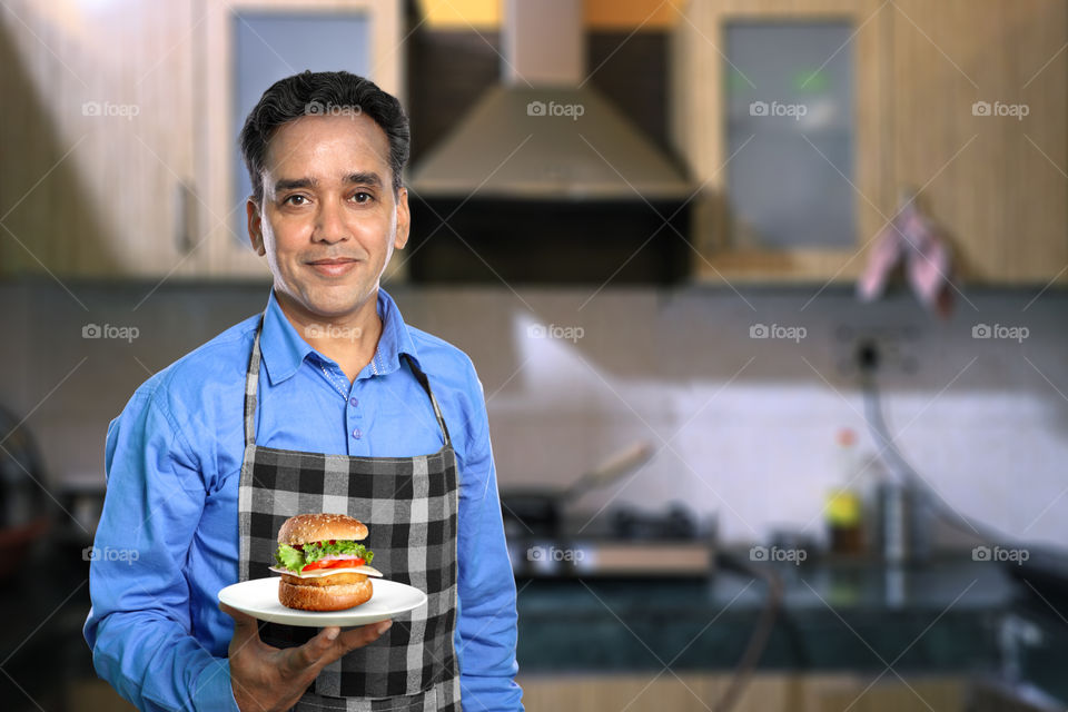 Indian man cooking at home