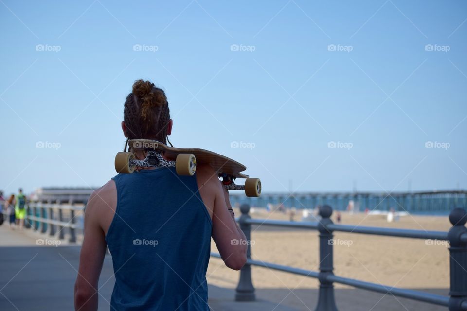 Man holding skateboard