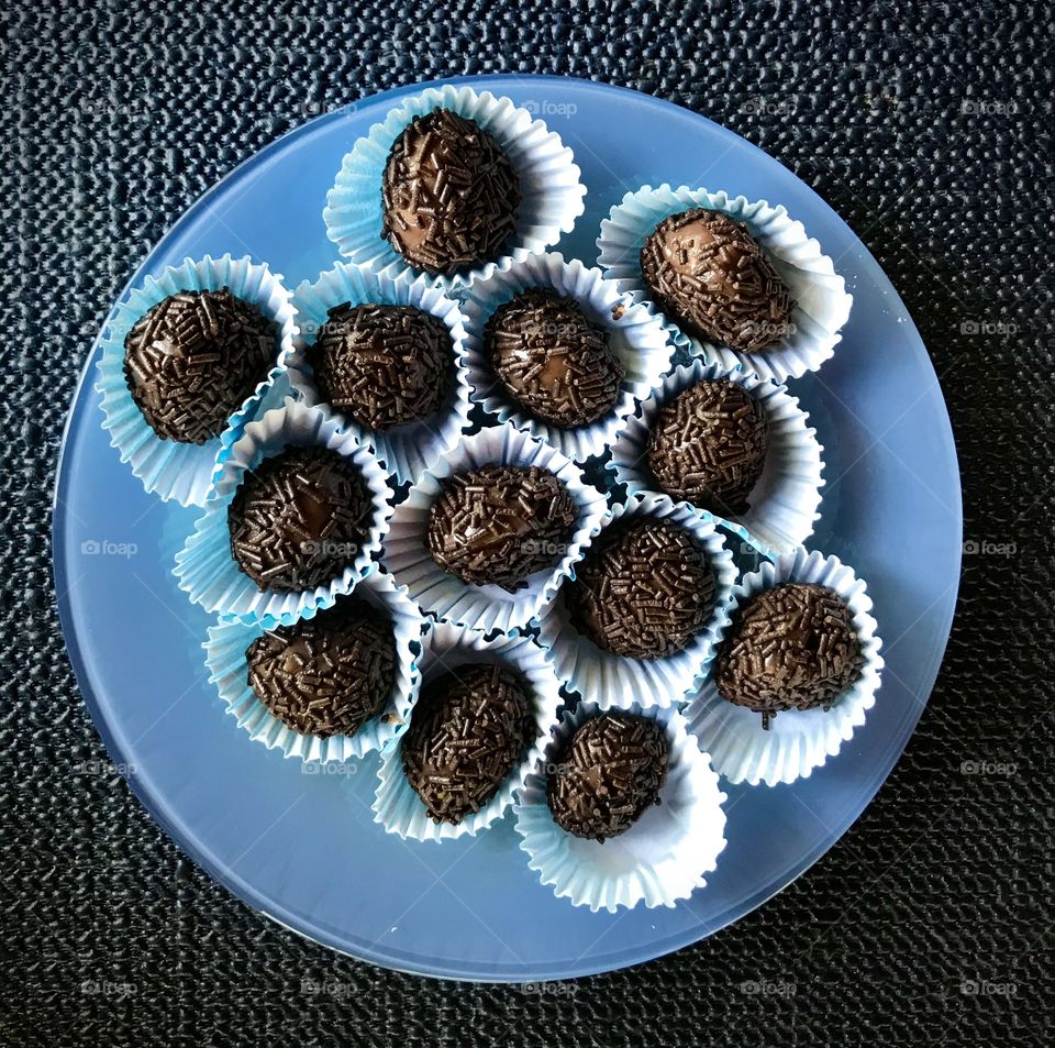 blue plate with chocolate brigadeiros