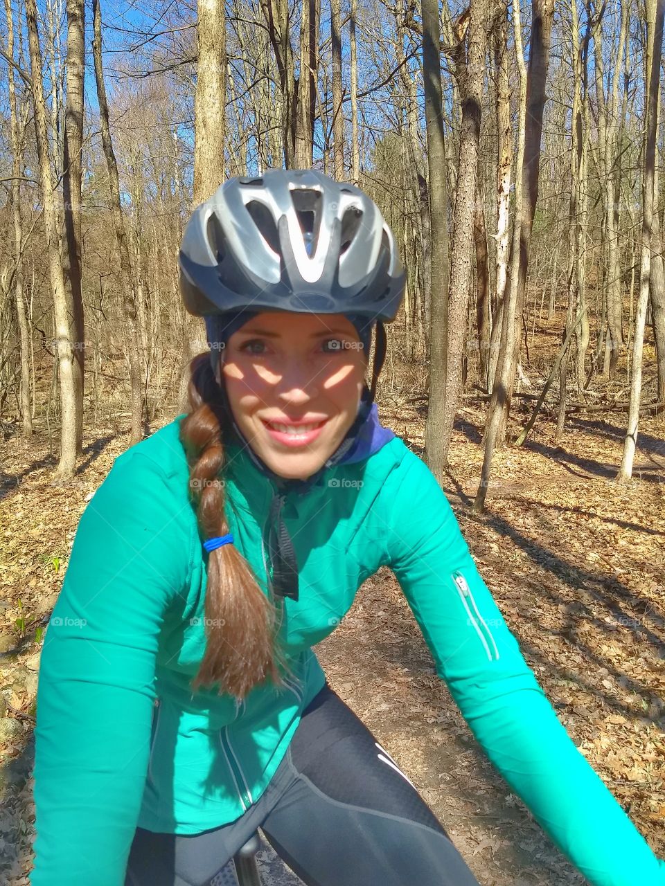 Beautiful woman smiling and bike helmet