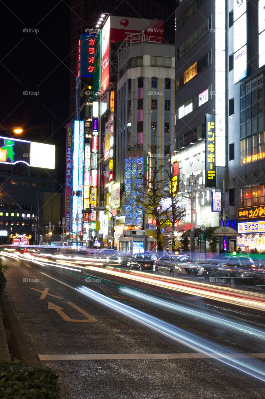 lights of a busy Tokyo street at night