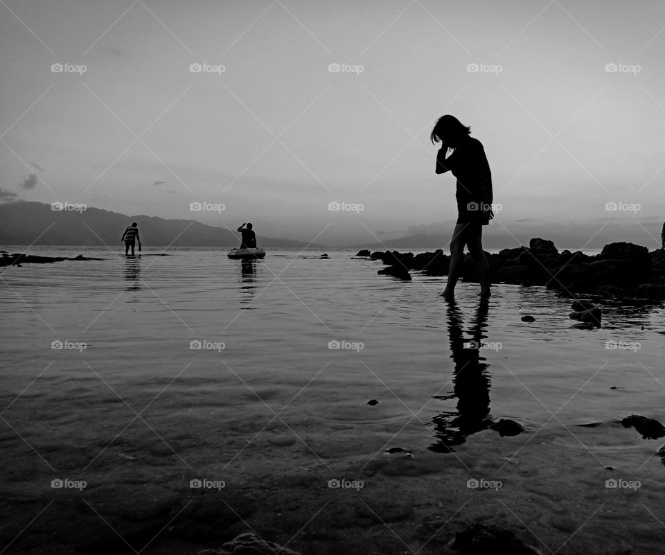 walking across the wide sea coast; 
in the world of black and white, searching for one's soul