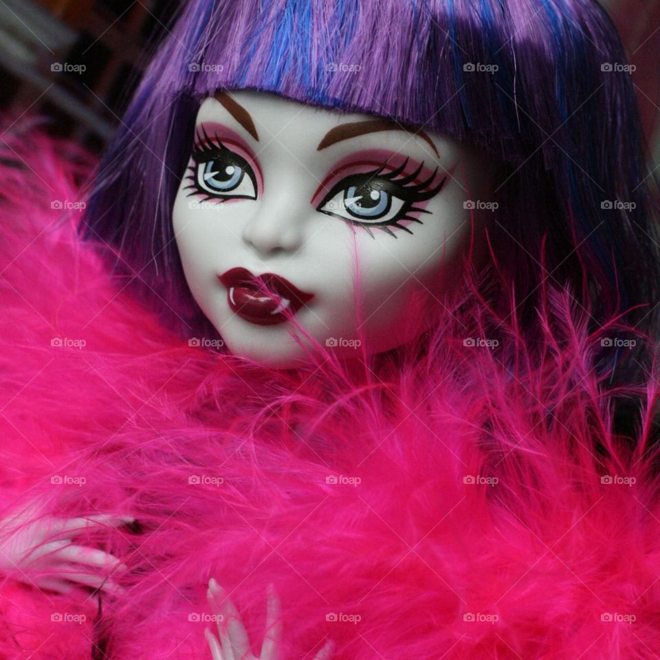 fancy crate a monster high dolls photo with purple hair and pink feather boa. glamour