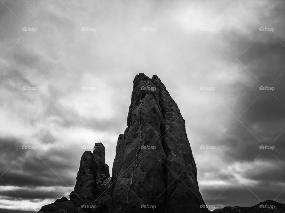 Dark, towering rock formation 
