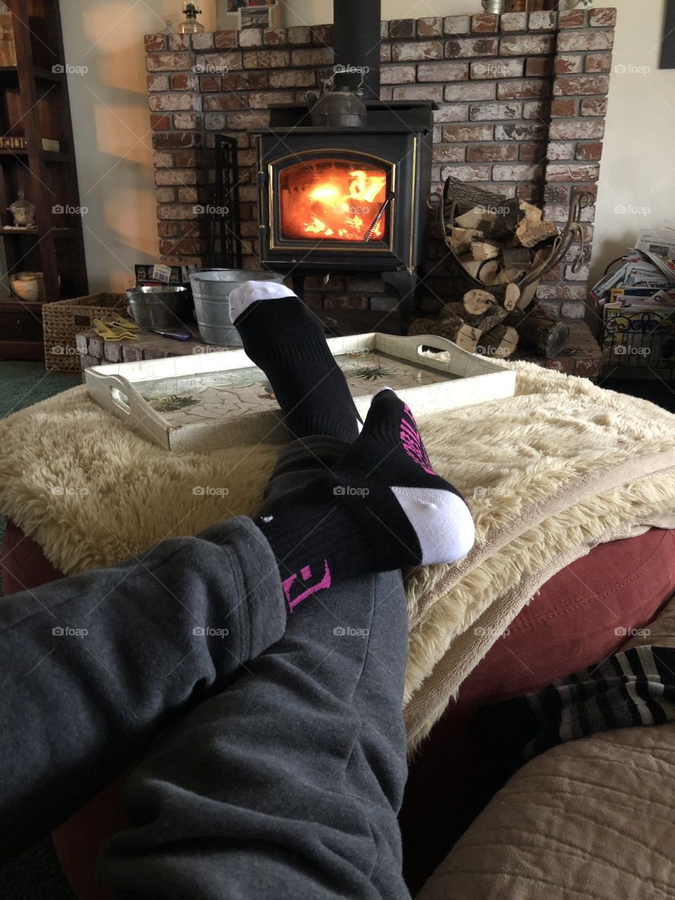 Kick back & relax with T-Mobile! 
advertising advertisement photo commercial T-Mobile #tmoble TMOBILE stocks fireplace warm feet winter time cozy wood burning stove