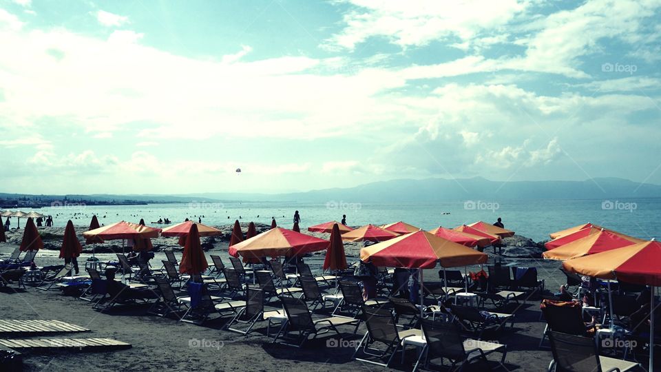 Beach with orange parasols