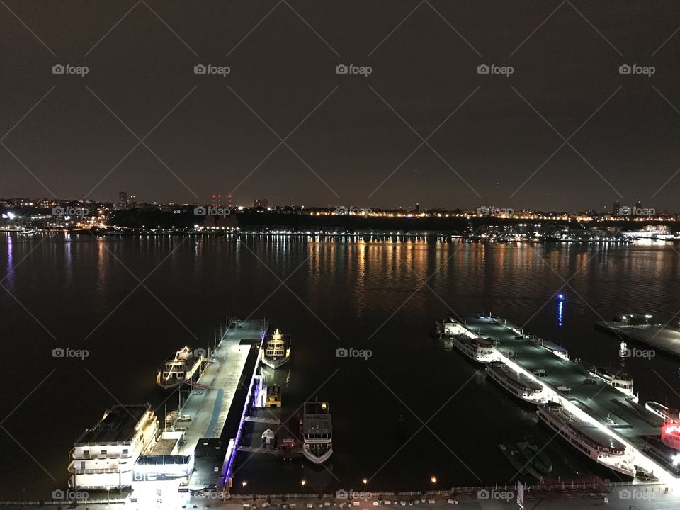 View of lights on the Hudson River from high rise building in New York 