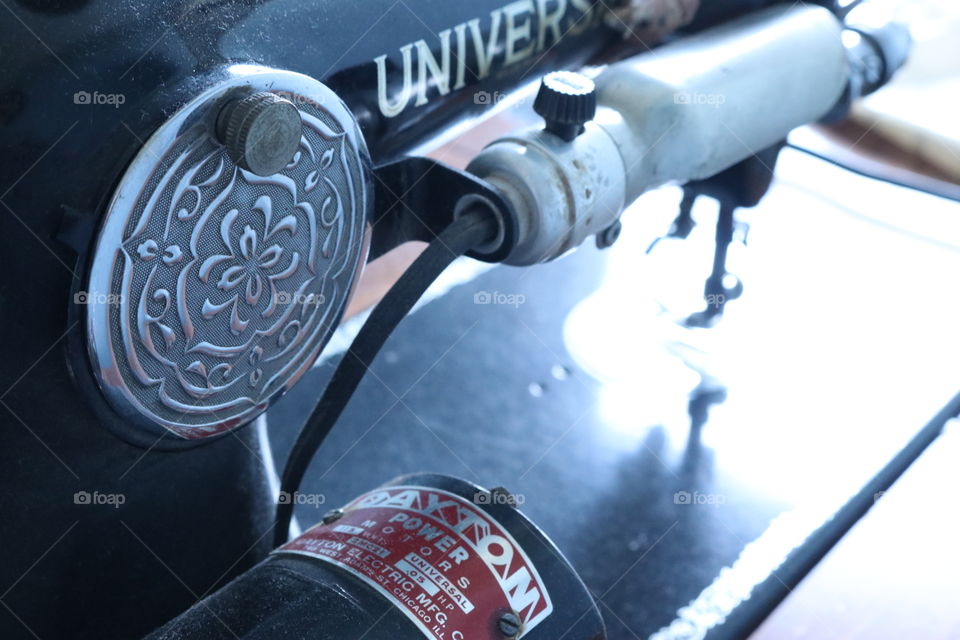 Old sewing machine with needle and thread