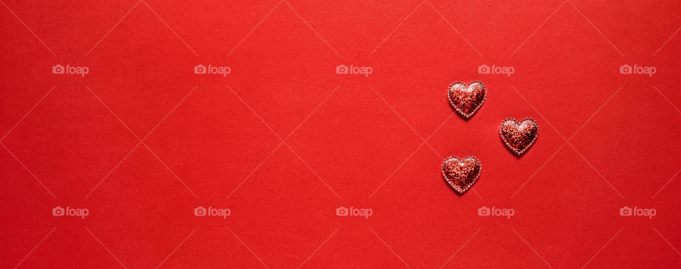 Postcard. Red hearts on a red background. Valentine's Day.