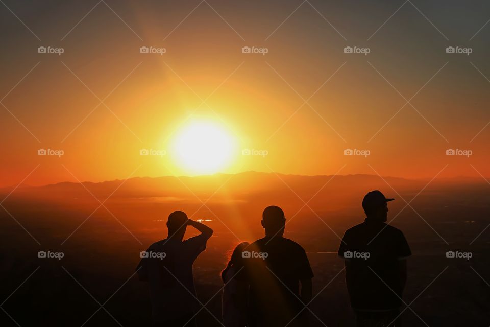 Silhouetted people at Arizona during sunset