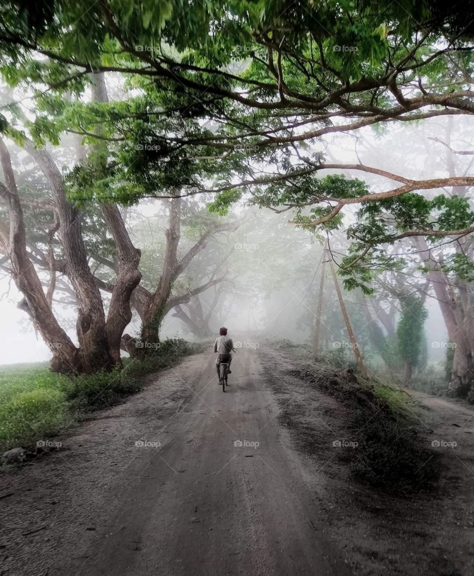 Cycling in a rural at a cold morning