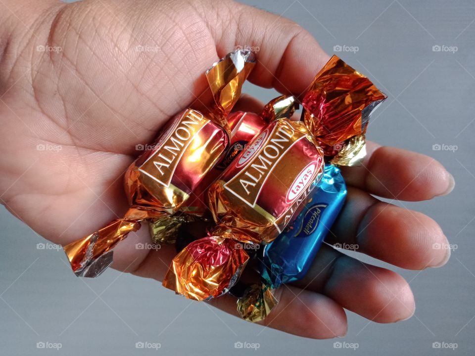 sweet toffees in my hand .