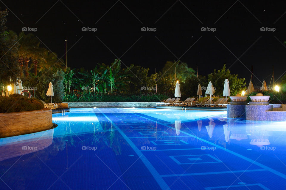 blue summer night pool by ippocampo